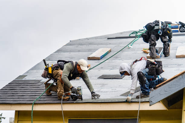 Professional Gutter Installation technician working in Sand Lake, NY